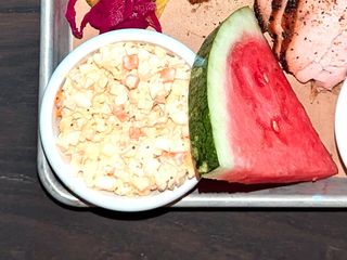 Photo: Pulled chicken, barbecued turkey breast, coleslaw, and potato salad -…