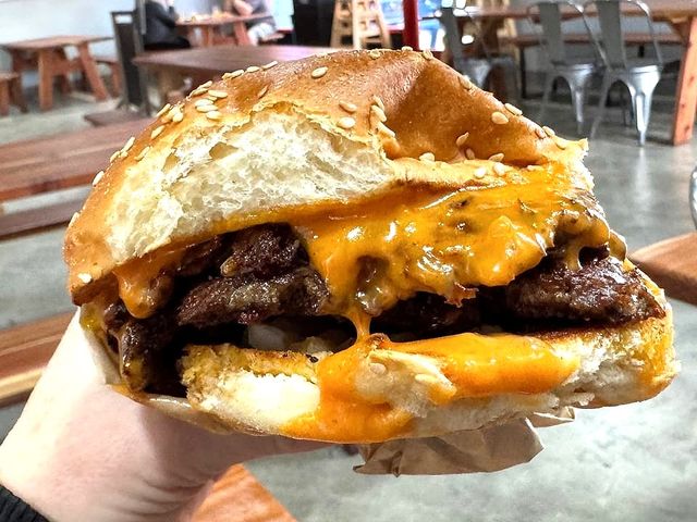 Illustrative photo of a double smash burger with melted cheese